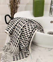 A black and white fluffy cotton bath towel