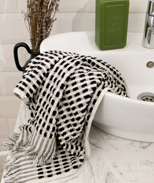 A black and white fluffy cotton bath towel
