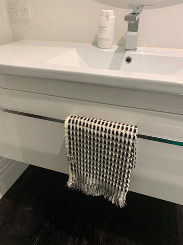 A black and white fluffy cotton bath towel