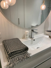 Amalfi bath set with sheet and hand towel. 100% cotton quality towelling with black dots and black and white tassels
