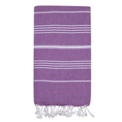A purple Turkish towel with small white stripes folded on a blank white background