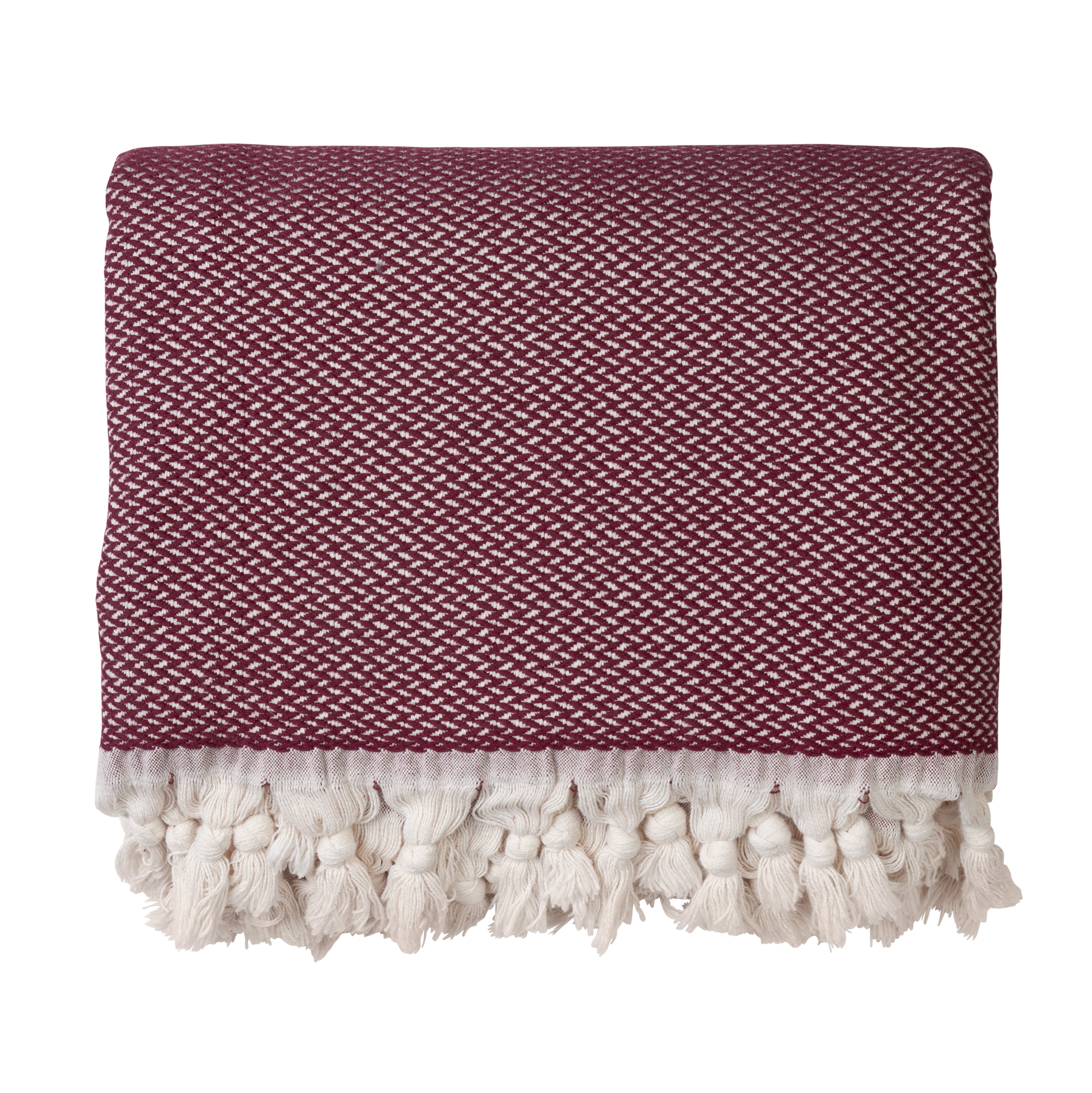 A burgundy throw blanket made from 100% cotton, with a herringbone pattern and fringed edges on a white background.
