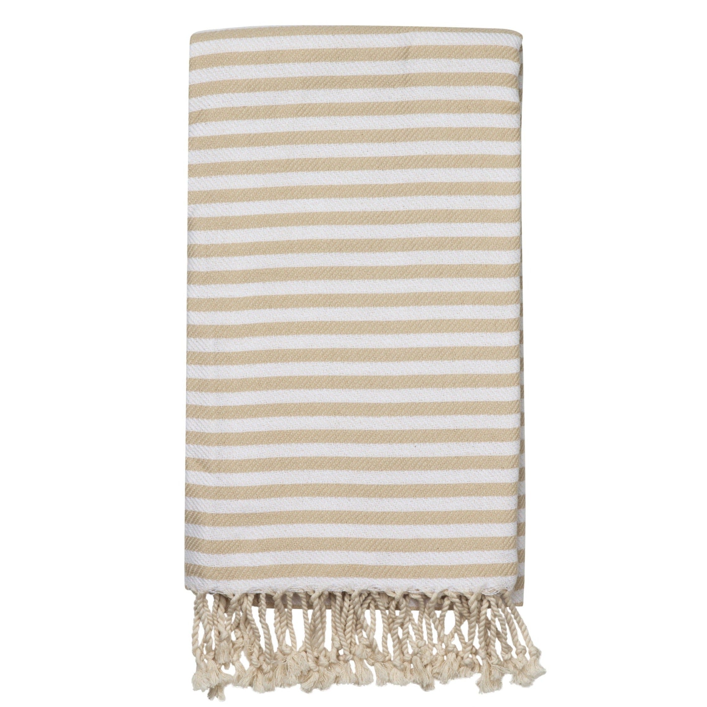 A beige and white striped Turkish towel with fringes at the bottom edge.