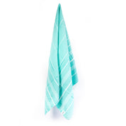 A turquoise Turkish towel with white stripes, displayed hanging from a hook.