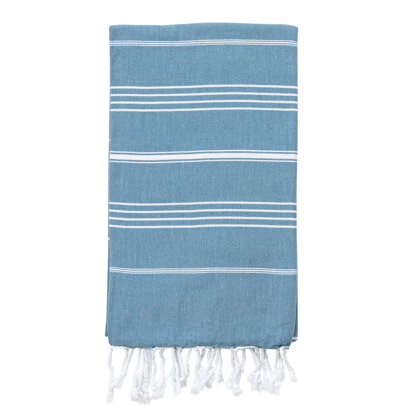 A striped Turkish towel in Aegean Blue with white stripes and fringes on the edges.