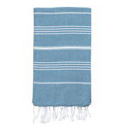 A striped Turkish towel in Aegean Blue with white stripes and fringes on the edges.
