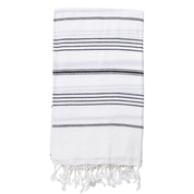 A folded white Turkish towel with black stripes and tassels on the bottom edge.