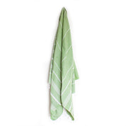 An Olive coloured Turkish towel hanging on a hook
