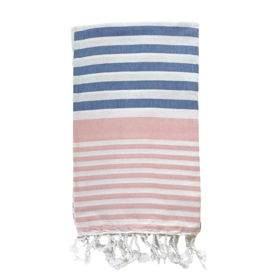 A folded blue, pink and white striped Sofia Turkish towel