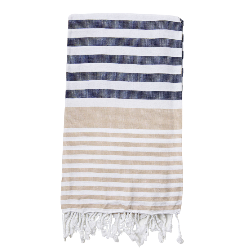 A Navy and Sand striped Sofia Turkish Towel with tassles at the bottom