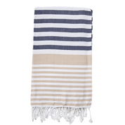 A Navy and Sand striped Sofia Turkish Towel with tassles at the bottom