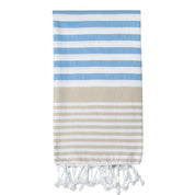 A folded striped Sofia Turkish towel in shades of sky blue and sand, with white stripes and fringes at the bottom.